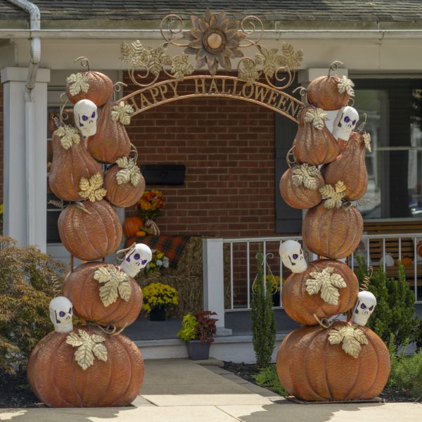 9.6 feet tall large iron Halloween arch with orange pumpkins, white skulls with purple LED lights, golden leaves and Happy Halloween sign in front of house entrance