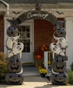 9.5 feet tall large iron Halloween Cemetery arch with purple LED lights in black pumpkins and white ghosts in front of home entrance