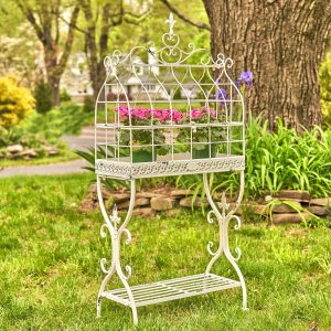 rectangular metal bird cage plant stand with fleur de lis details and shelf in antique white