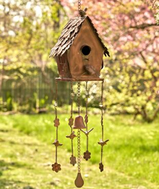 full length image of metal hanging on a chain A-frame birdhouse with square bottom and wind chimes in antique copper finish