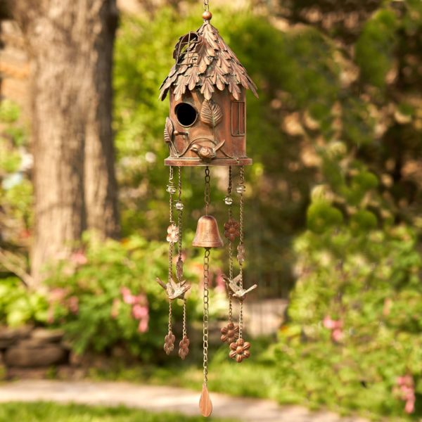 full length image of metal hanging on a chain cylinder shaped birdhouse with wind chimes in antique copper finish