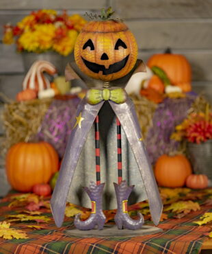 27 inch tall iron pumpkin bobble head with a lid in purple coat and boots