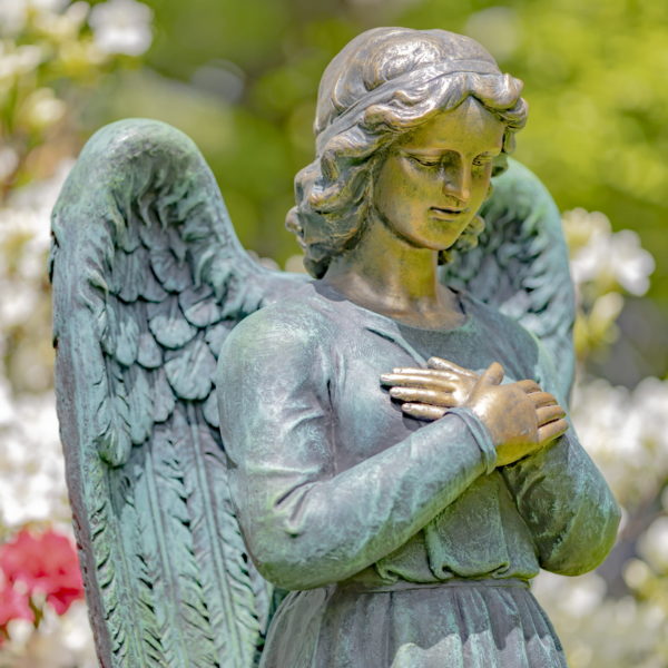 closeup of 47 inch tall magnesium angel statue in a hand painted distressed bronze-copper-teal finish