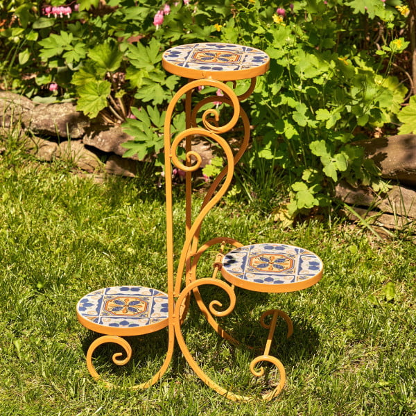 3 tier iron mosaic plant stand with mosaic tiles in light orange in garden