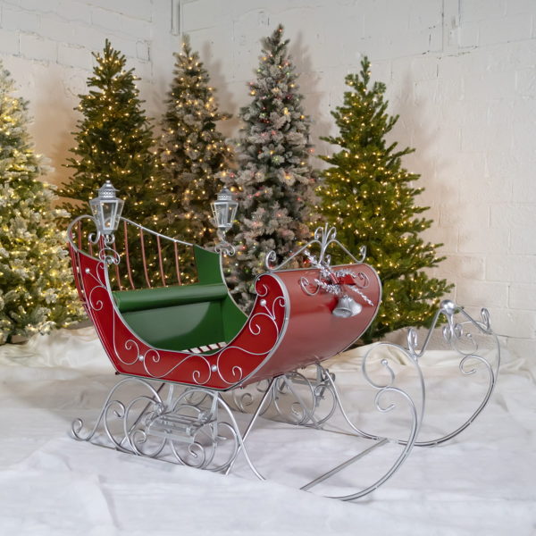 Large Victorian Christmas sleigh in red, green and silver with 2 lanterns on each side and filigree details