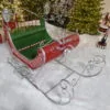 top view on Large Victorian Christmas sleigh in red, green and silver with 2 lanterns on each side and filigree details