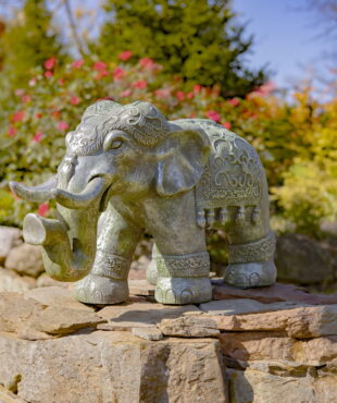 side view of 16 inch tall magnesium elephant statue in boho style with cape and hat in frosted silver finish