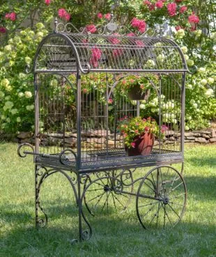 Large iron flower cart with curved roof real rotating wheels and handle painted in antique bronze finish