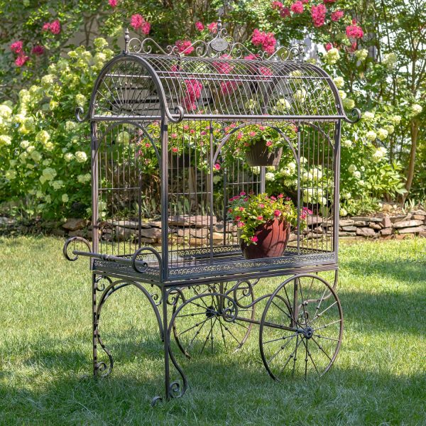 Large iron flower cart with curved roof real rotating wheels and handle painted in antique bronze finish