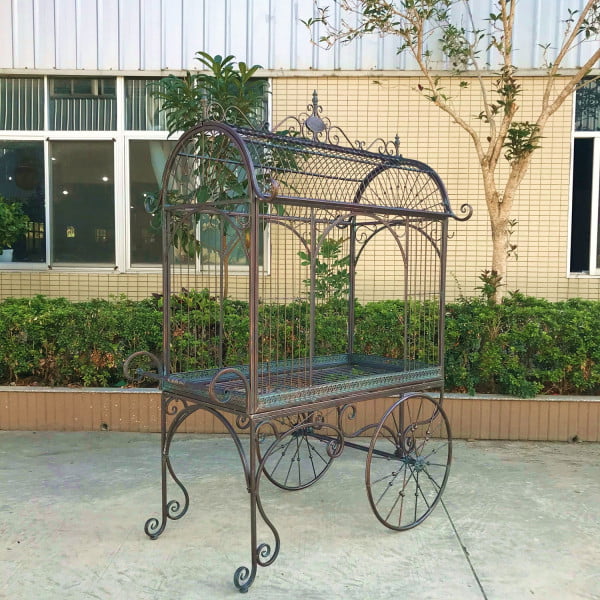 Large iron flower cart with curved roof real rotating wheels and handle painted in antique bronze finish