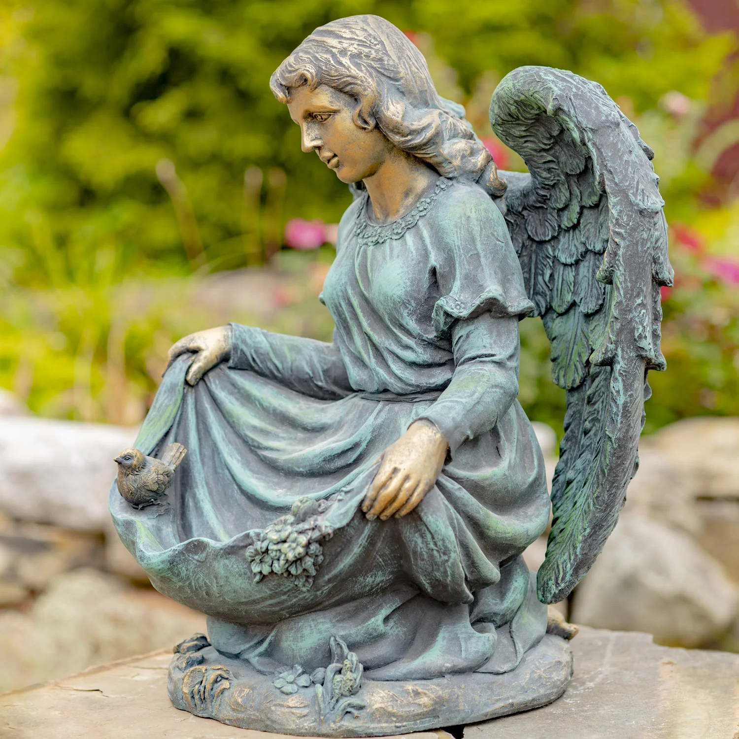 Side View of Angel Sitting Indian Style with Bird Details and Bronze Finish