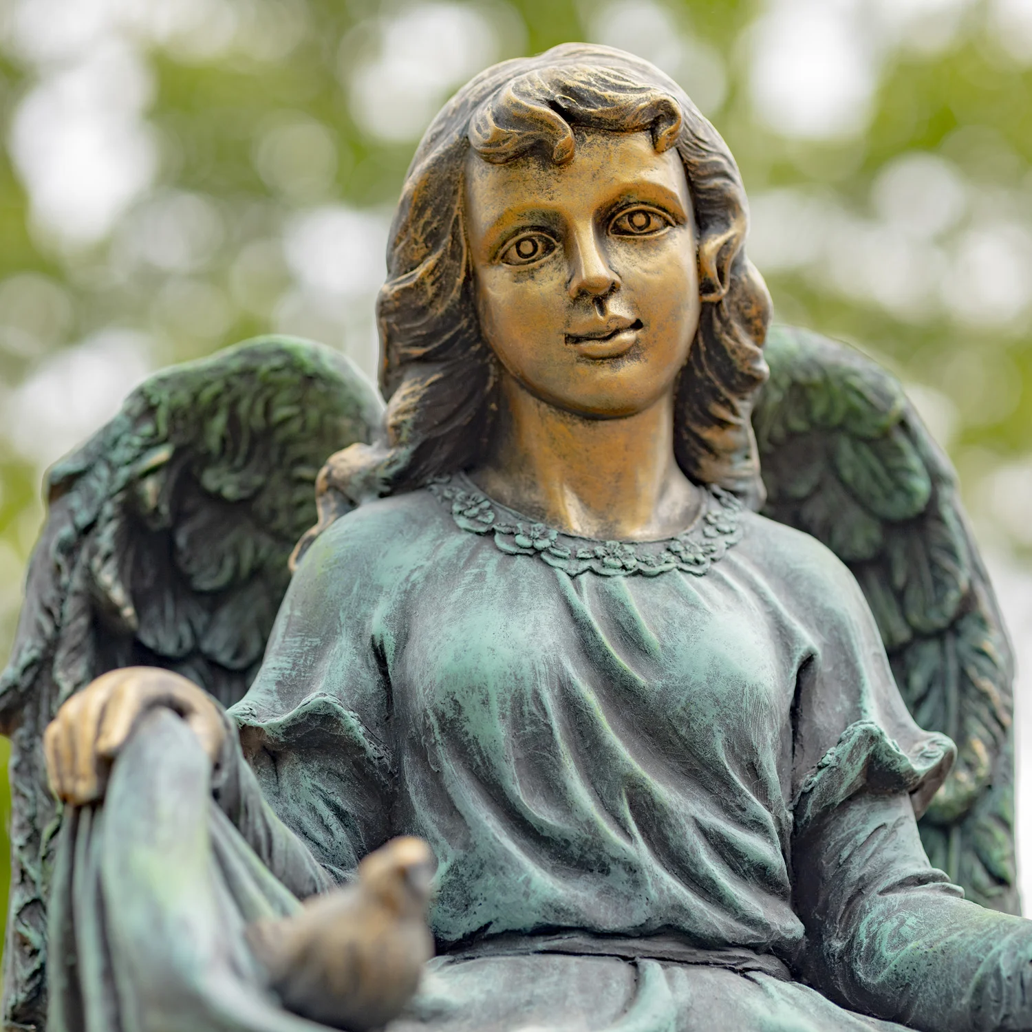 Close View of Bronze Angel with Bird Details
