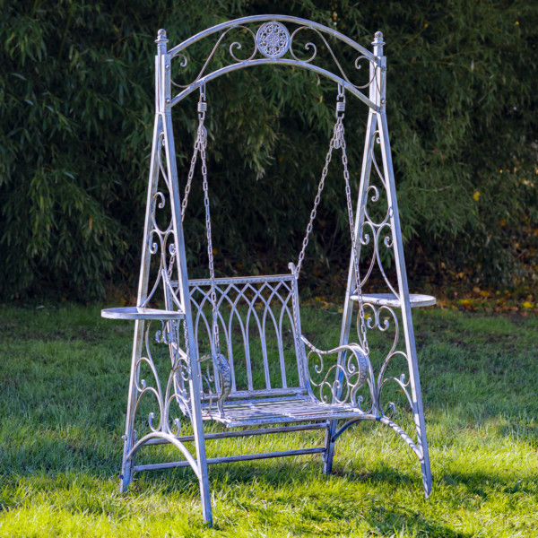 Blue bronze iron swing chair with curlicue designs on the sides