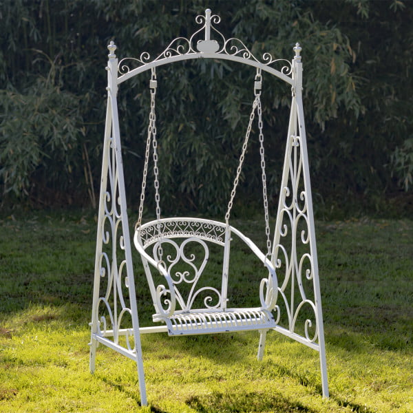 Angled Full View of Antique White Swing Chair Hanging From an Iron Chain