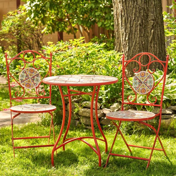 Iron bistro set for 2 people with 2 folding chairs and 1 table in dark red color with mosaic tiles in garden