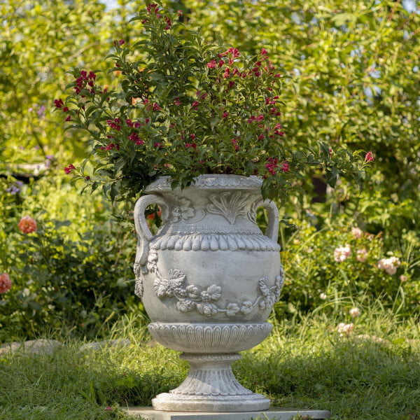 30.7 inch tall classic urn style flower planter with ornaments and 2 handles in antique white finish in garden