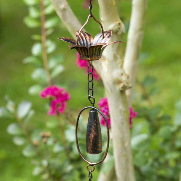 closed up image if iron rain chain with daisies and chimes in antique bronze finish