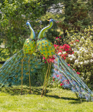 One set of two large colorful Peacocks with Royal and Saphire jewels attached on the feathers standing tall and upright in the air and the body