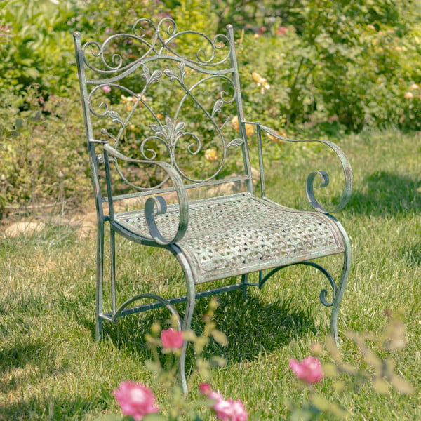 Metal Armchair with Weaved Pattern Seating in a Green Finish- Floral Back ground
