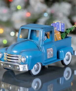 Small Blue and Silver Truck with gifts and Christmas Tree in the back Truck