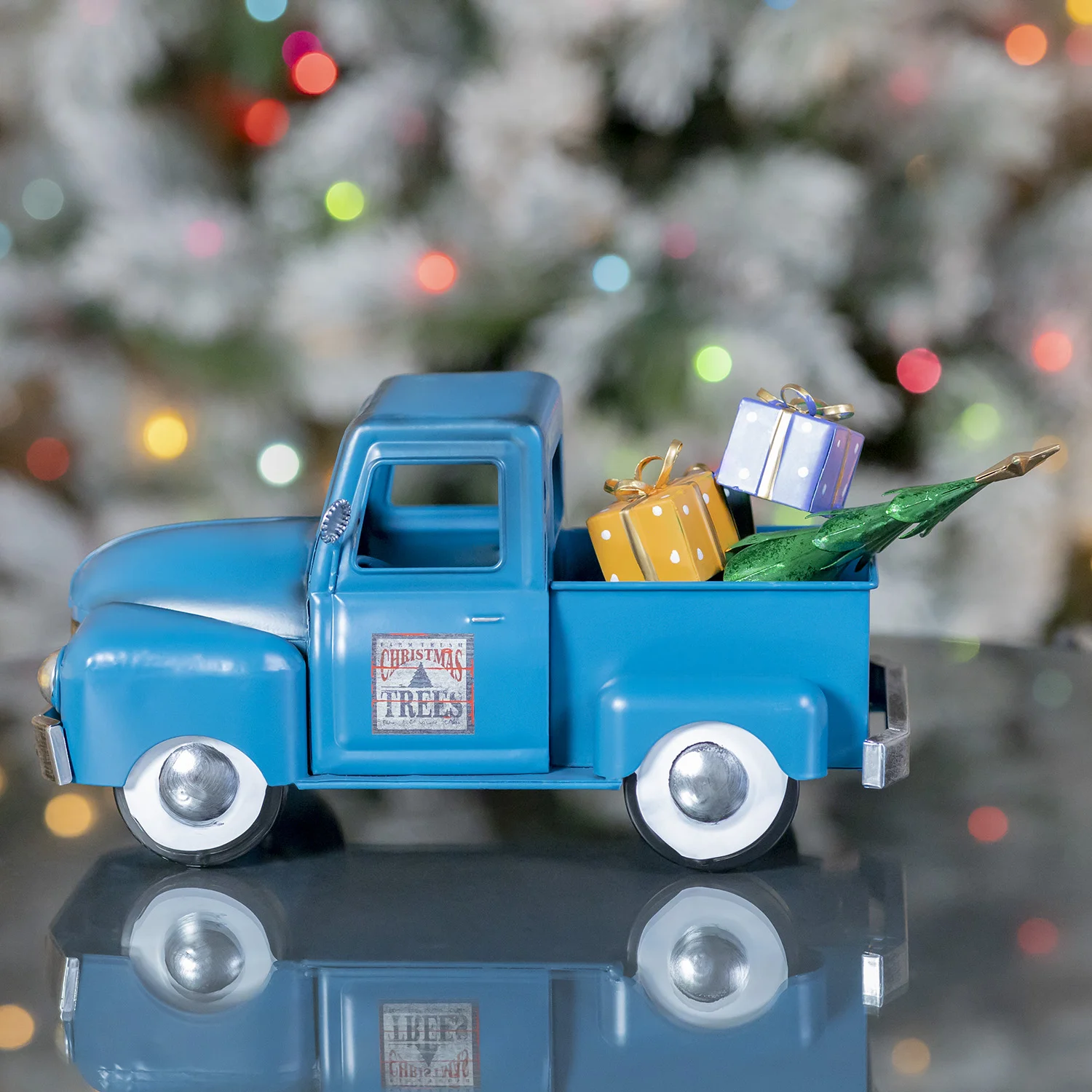 Small Side View of Metal Blue and Silver Pick Up Truck with Gifts and Christmas tree in the Back