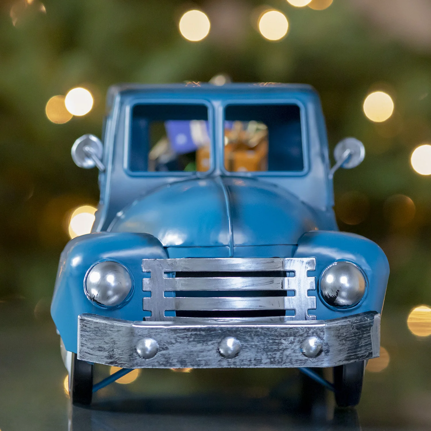 Front View of Small Blue Silver Truck