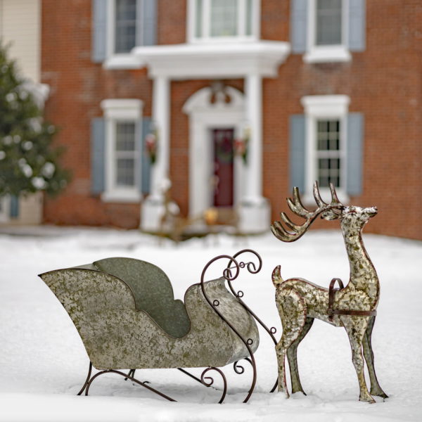 four foot long galvanized iron reindeer and sleigh decorations with a weathered, antique looking silver finish