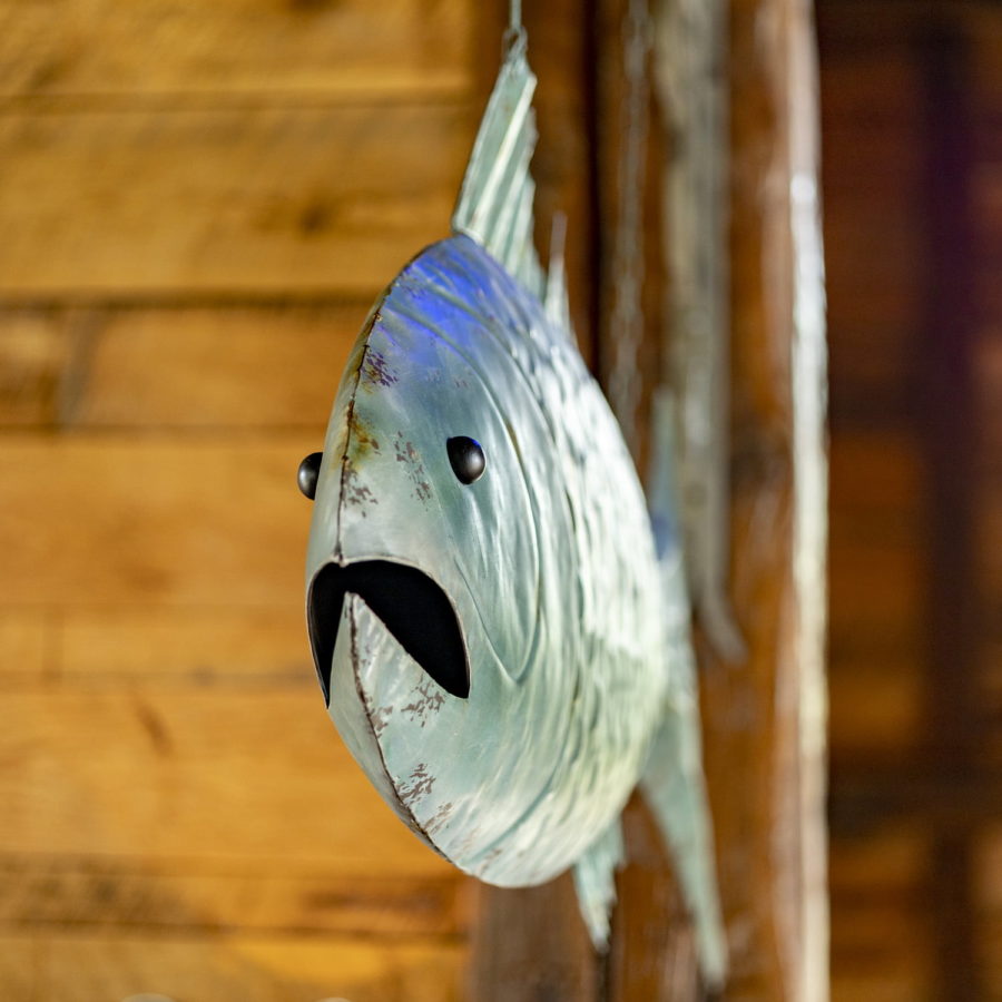 Closeup of Large Hanging Fish Welcome Wall Decor