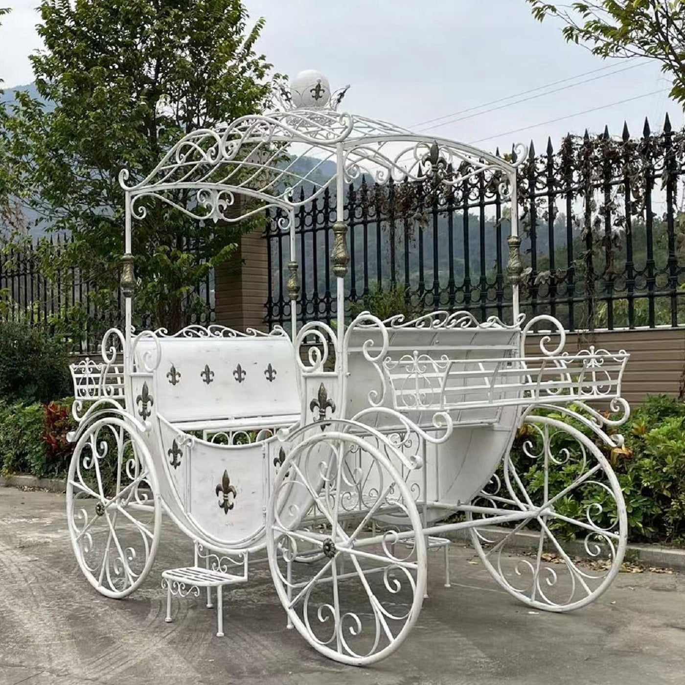 rear view image of large parisian style iron Carriage with planters in white finish