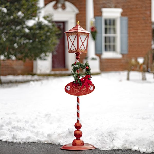 red standing Christmas lantern with round base