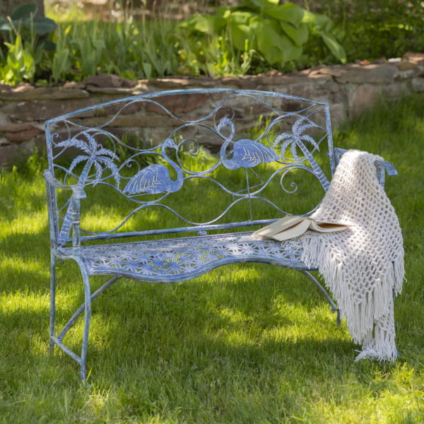 blue metal bench with flamingo and palm tree backrest and curved seat