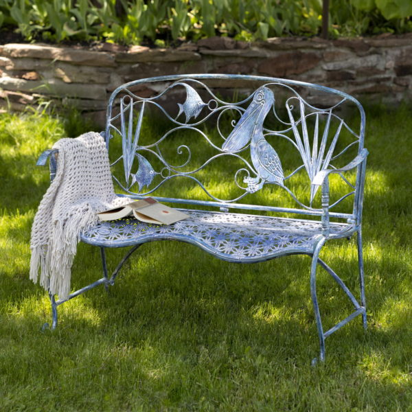 blue metal garden bench with pelican and angel fish backrest