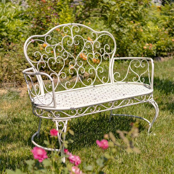 Antique white iron garden bench with heart shape curlicue designs