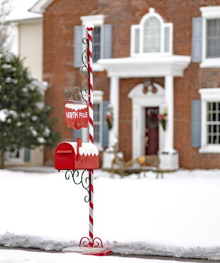 72 inch tall metal Christmas mailbox with candy cane stand and North Pole hanging sign