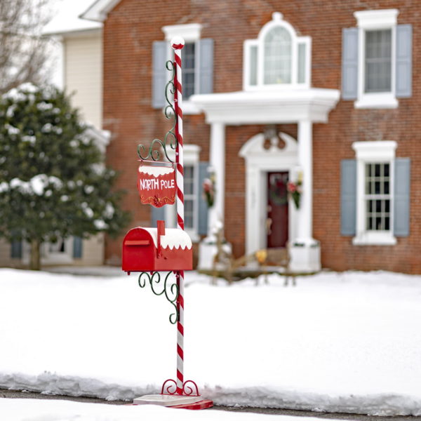 72 inch tall metal Christmas mailbox with candy cane stand and North Pole hanging sign