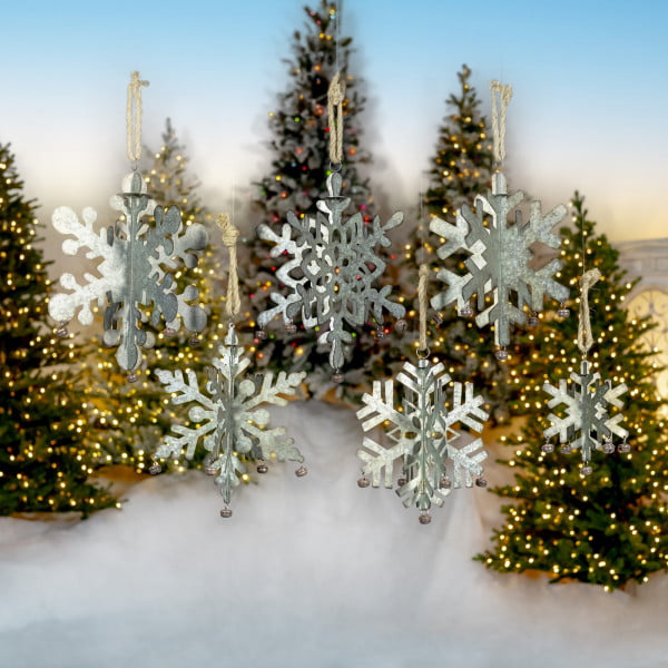 set of 6 galvanized metal folding snowflakes in 6 assorted shapes and sizes with bells hanging on a rope