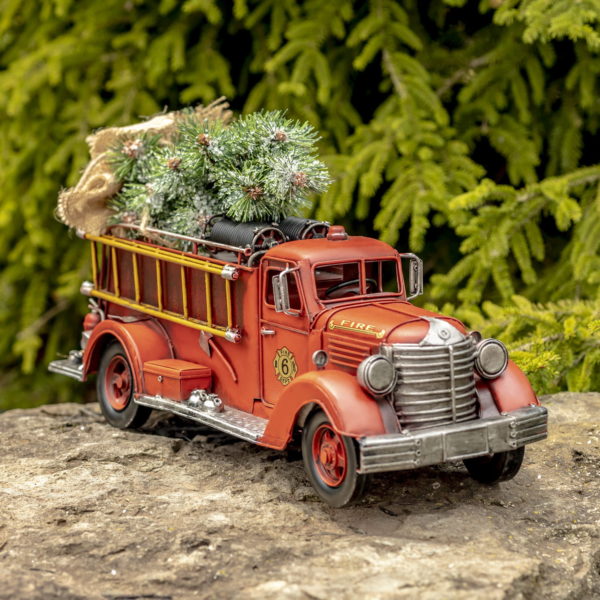 Angled View of Antique Style Firetruck with Christmas Tree on the Trooftop