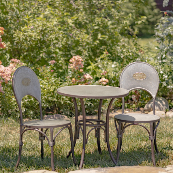 Three piece round galvanized plain bistro set with one table and two chairs that has the Zaer Ltd logo imprinted on the backrest of the chairs