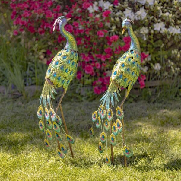 Each peacock body is fully encrusted in large tear drop shaped gems that extend down their flowing tails