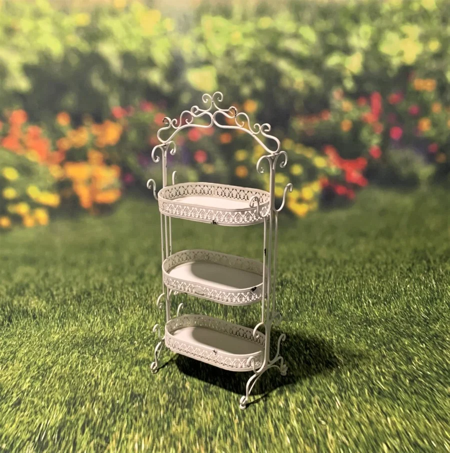 Full image of the Antique White three tier Plant Stand with curlicue designs at the top, sides and bottom of the item