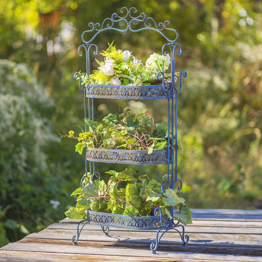 Full image of the Antique Blue three tier Plant Stand with curlicue designs at the top, sides and bottom of the item