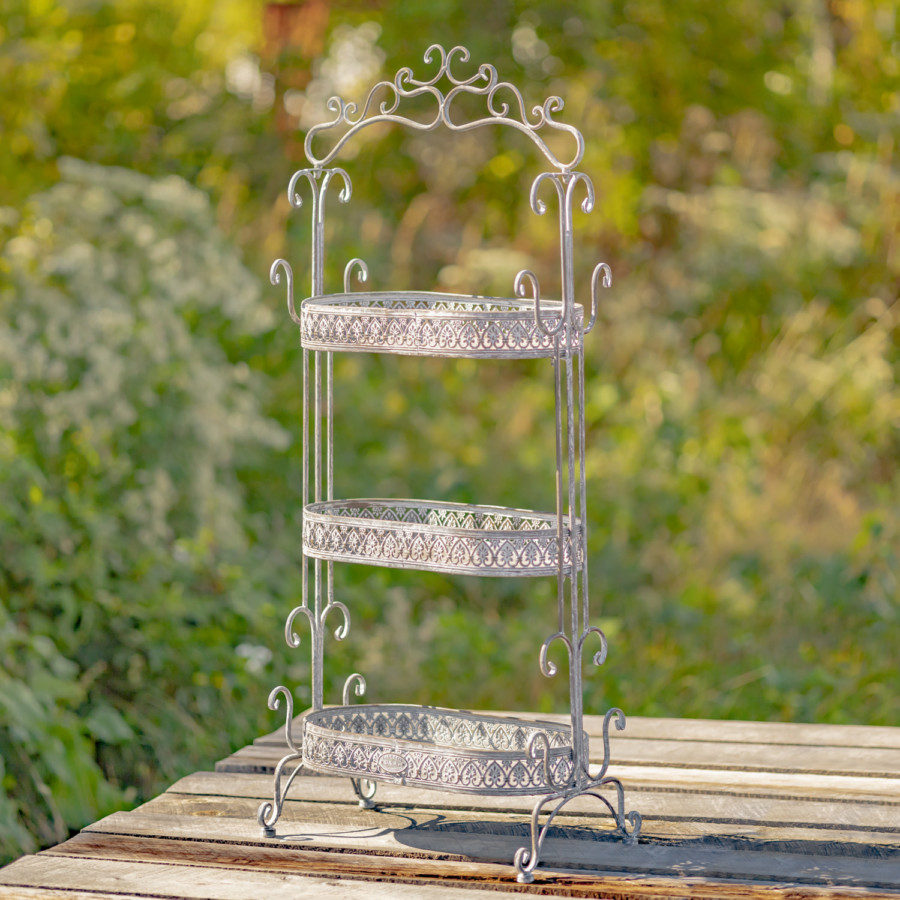 Full image of the Antique Grey three tier Plant Stand with curlicue designs at the top, sides and bottom of the item