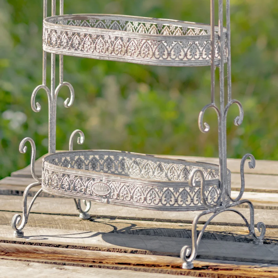 Close up image of the bottom of the Antique Grey Plant Stand showing you the detailed design around ever tier