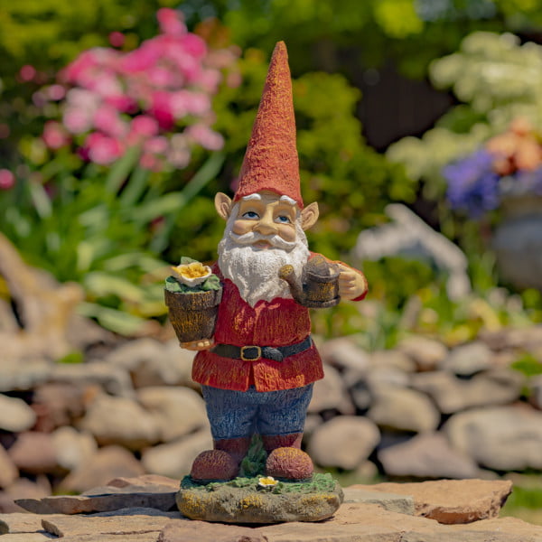 Spring garden gnome holding flower pot and water can