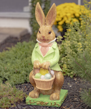 Tall Magnesium Easter Rabbit Statue in Green ,Pink and White suite holding a basket of Easter colorful eggs