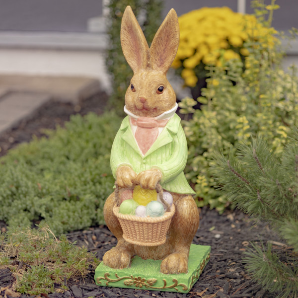 Tall Magnesium Easter Rabbit Statue in Green ,Pink and White suite holding a basket of Easter colorful eggs