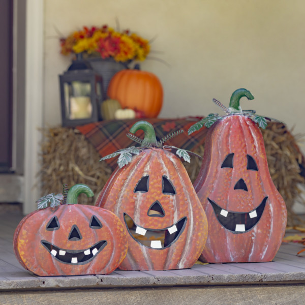 A set of three metal pumpkin Halloween lanterns in three different shapes