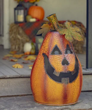 Full image view Large Metal Lantern in the shape of a pumpkin that is a candleholder