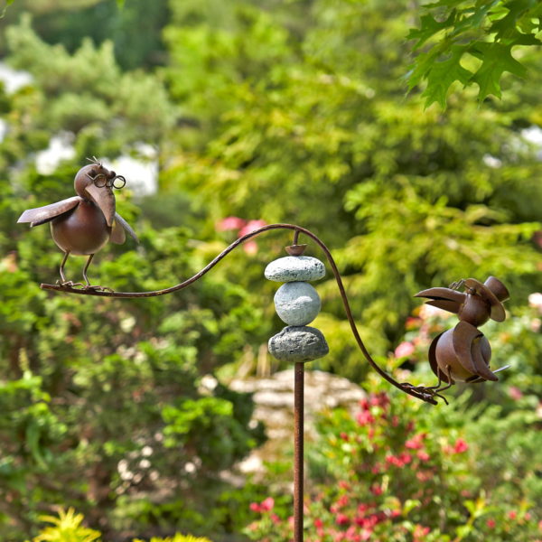 rust colored balance stake kinetic garden decoration with raven birds