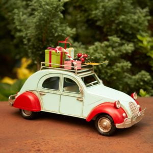 Small Red and Blue Buggy Car with Christmas Gifts on the Roof